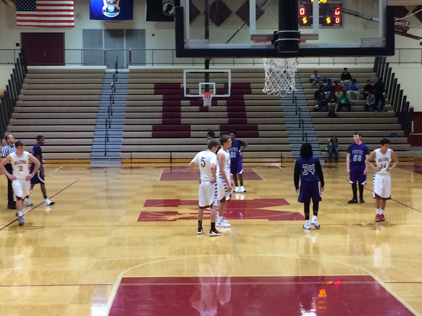 The Milford JV basketball team starts off with only four players on the court in their first home game, leaving a spot open in honor of Cole.