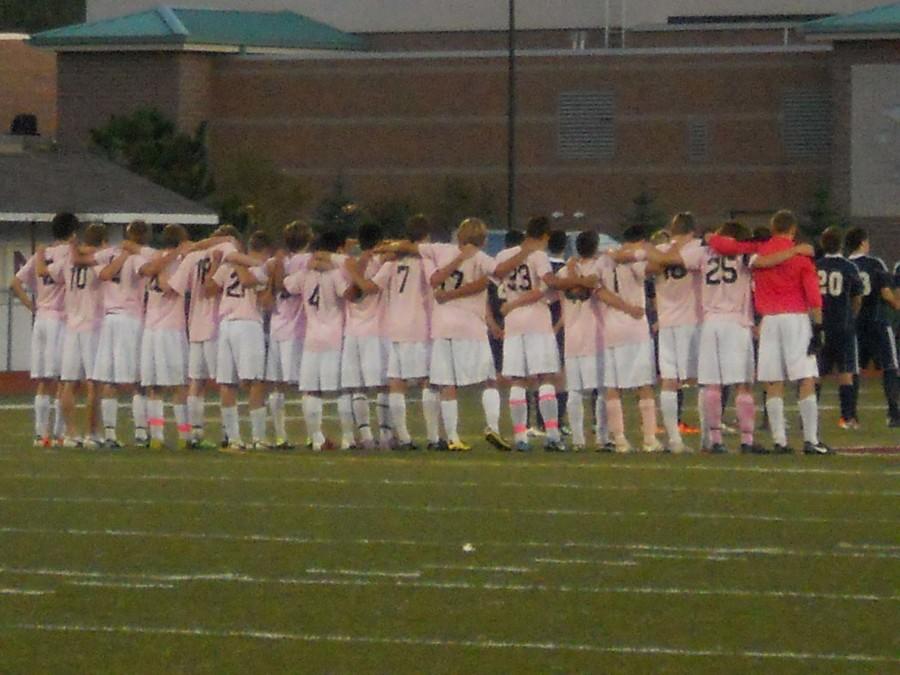 The Boys Varsity Soccer team united for the National Anthem. The Picture was taken on Senior Night against Hartland High School. Though the team did not win a ton of games, many players said they made progress for future years. 