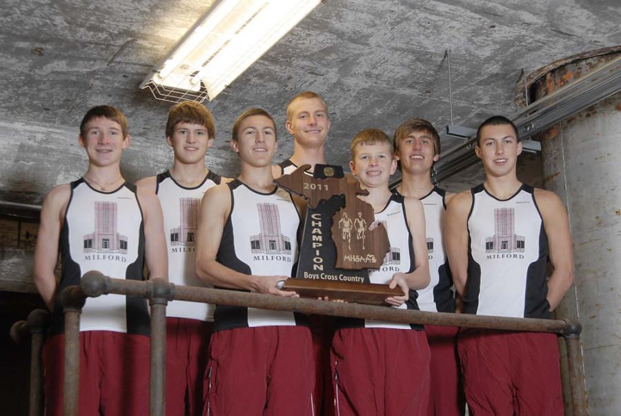The Milford High School Cross Coutnry team takes a group photo with the trophy after winning the State Championship. Left to right; Brian Kettle, Matt Graves, Cody Snavely, Steven Sloboda, Chris Housel, Paul Ausum, Shawn Welch (Photo Courtesy of Coach Brian Salyers)