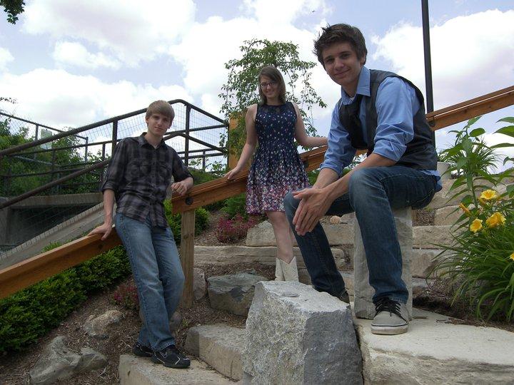 From left: Juniors James Richardson, Carmen Gibes, and Shaun Richardson have been a part of Cats and the Fiddler since 2001 and continue to perform around the area.