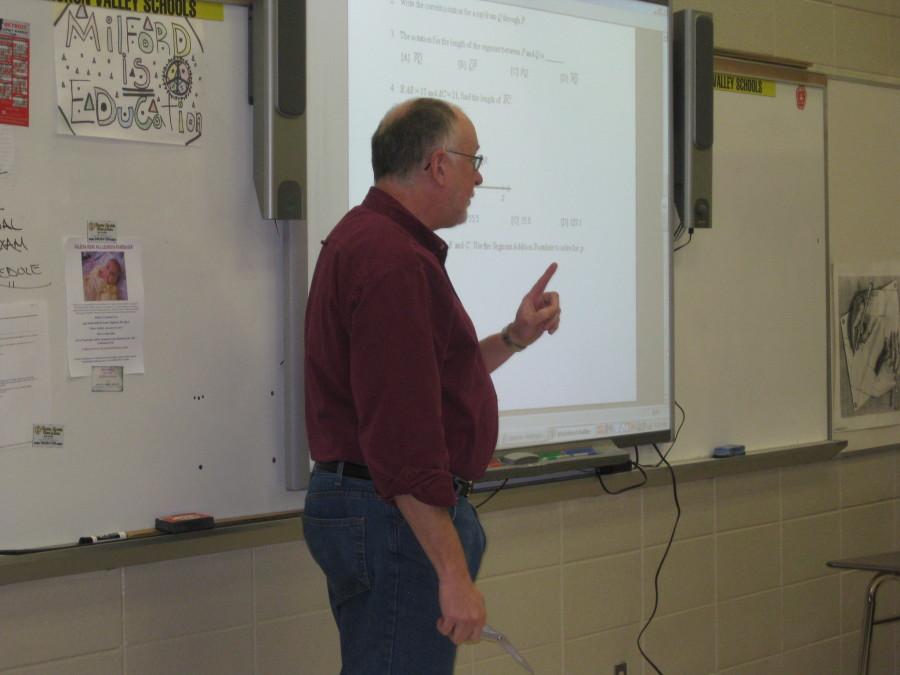 MHS Math Teacher Scott Riggs teaches his Honors Geometry class, which features several 8th graders.
