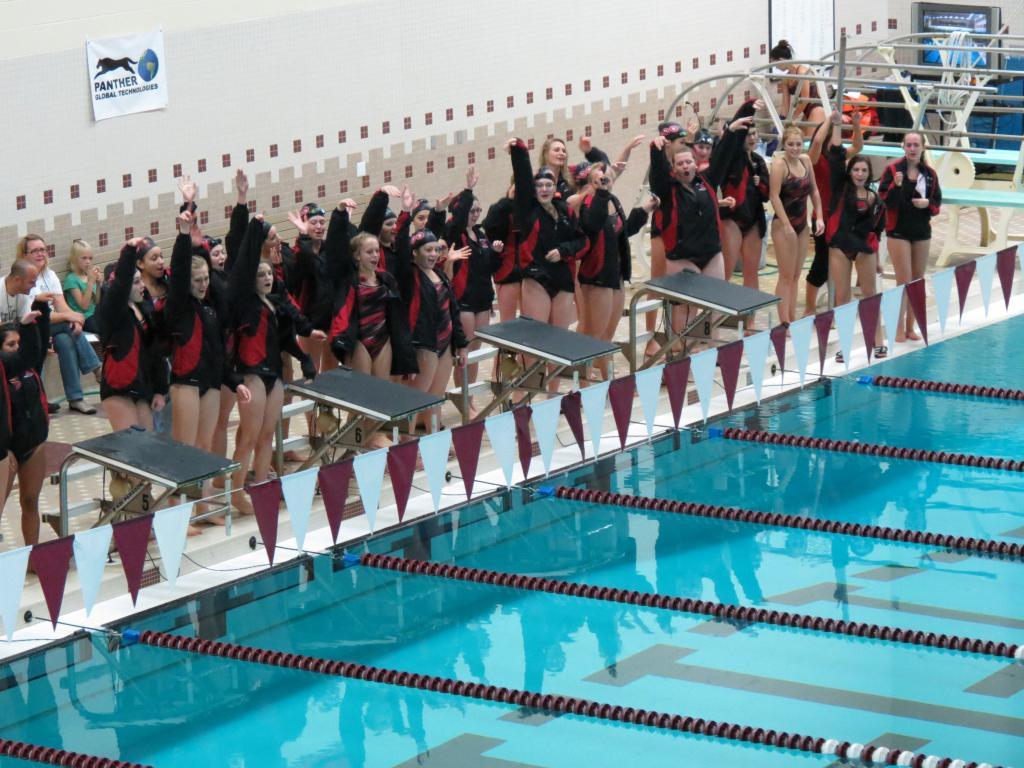 The team prepares for their Senior Night Meet against Pinckney.