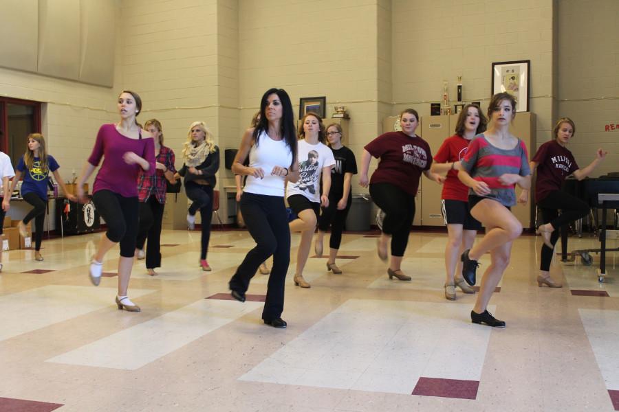 The cast practicing their routine to perfect the performance at the musical.