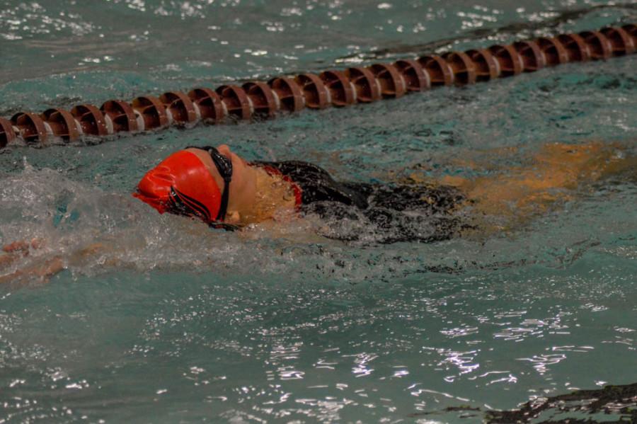 Milford swimmers and divers improve times, scores