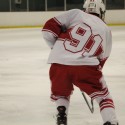 Junior Josh Bauer skates during MHS hockey action.