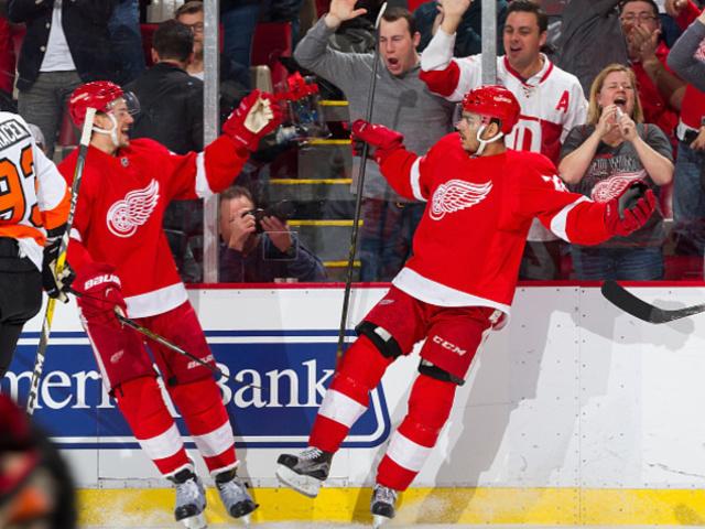 DETROIT, MI - APRIL 06: Andreas Athanasiou #72 of the Detroit Red Wings celebrates his goal with teammate Danny DeKeyser #65 during the second period of an NHL game against the Philadelphia Flyers at Joe Louis Arena on April 6, 2016 in Detroit, Michigan. (Photo by Dave Reginek/NHLI via Getty Images)