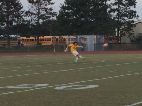 Goalie Nathan Bresnay clears the ball in the first half against Pinckney.