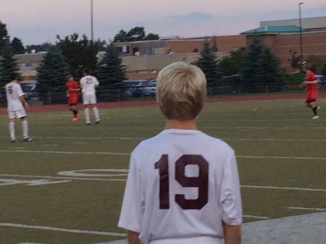 Sophomore Spencer Beckman gets ready to enter the game against Pinckney High School.