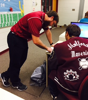 Mr. Adams working with one of his students in his E2020 class. 