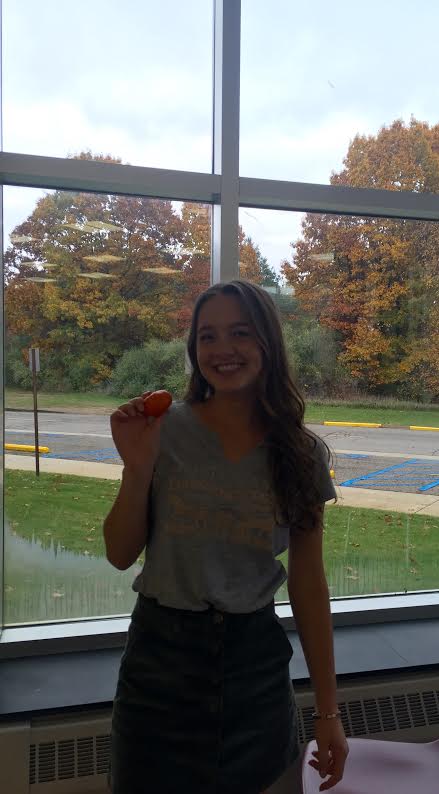 Senior, Claire Sysko, poses with her favorite snack. 