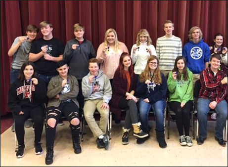 Students holding blue division 1 medals. From left to right, Caden Probe, Ryan Cleasby, Dan Ellis, Madison Hinman, Nicole Hinman, Austin Pike, Caleb Muholland, Rebecca Loncar, Jillian Weisberg, Jamee Arseneault, Joe Antrim, Sierra Staman, Kendyll Klingensmith, Emma Foster, and Blake Drow.