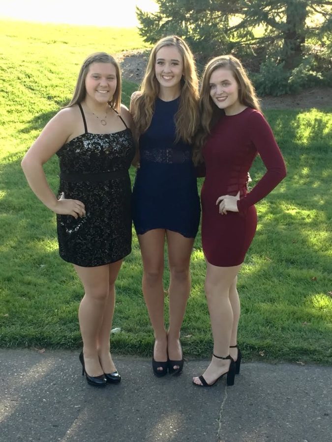 Left to Right: Senior Janna Duncan, senior Katie Lakkides, and senior Megan Miller at the Milford High School Homecoming. (Photo Courtesy of Brian  Lakkides.)