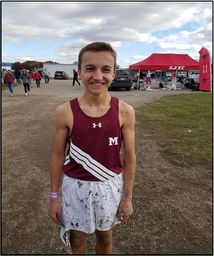 Freshman Ryan ORourke after the State finals covered head to toe in mud. (Photo by Michael Stevenson)
