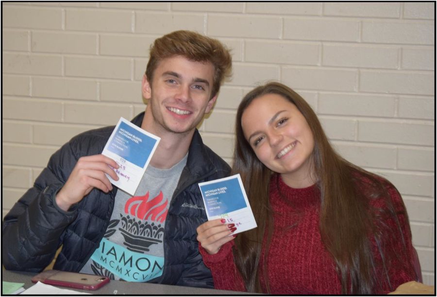 Trevor Hoppe and Claire Thomas working the blood drive desk.  