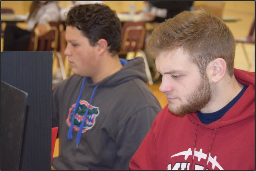 Jack Sherman and Jayson Julian filling out their information. 