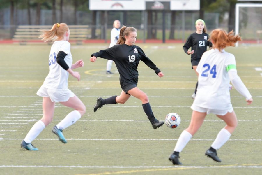 Freshman Reagan Allen in the Milford Varsity vs. Rochester game during the 2019 Spring season (Photo courtesy of Jerry Rea)
