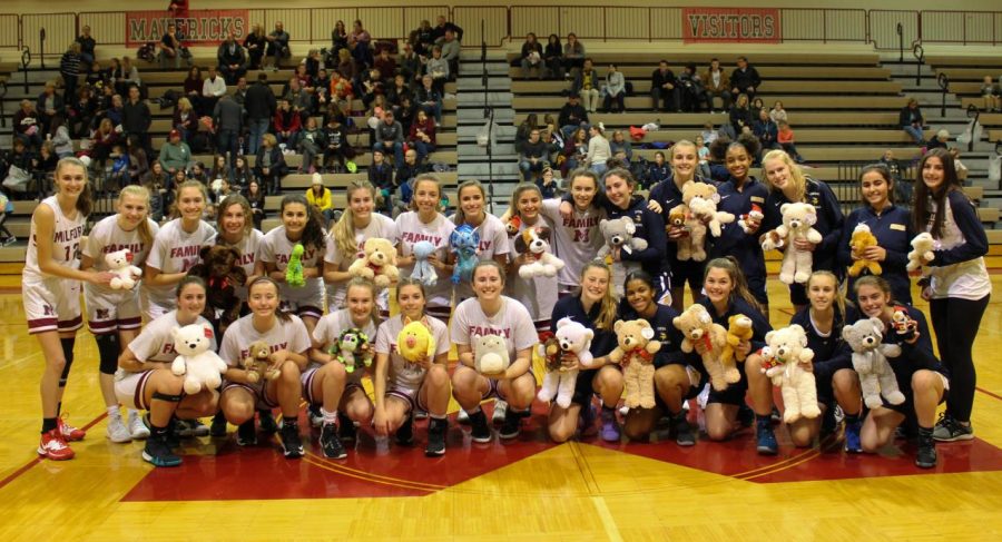 Both Milford and Walled Lake Central before the game with toys the teams will be donating