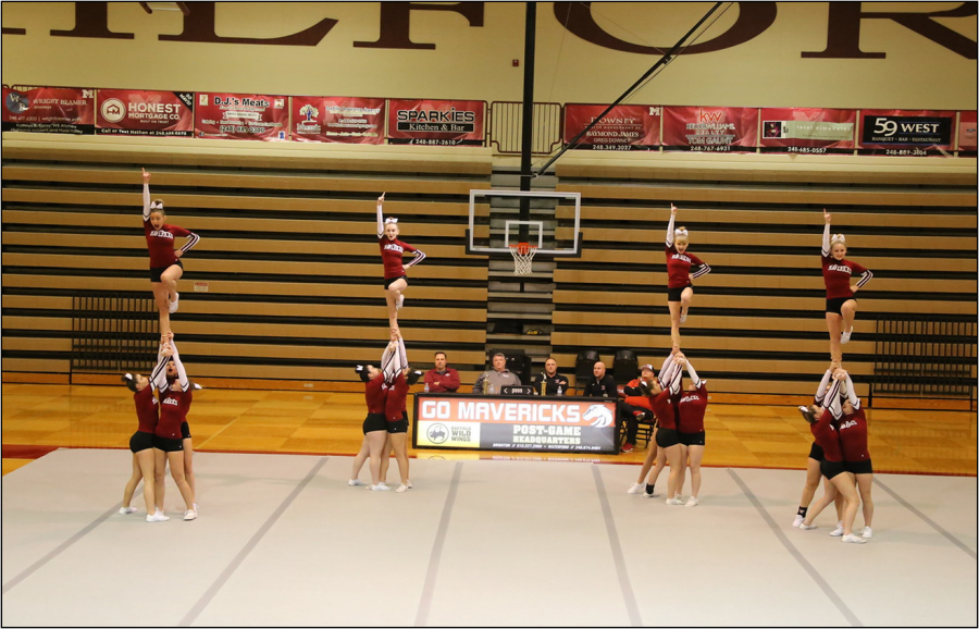 MHS cheerleaders performing a lib in their round 3. 