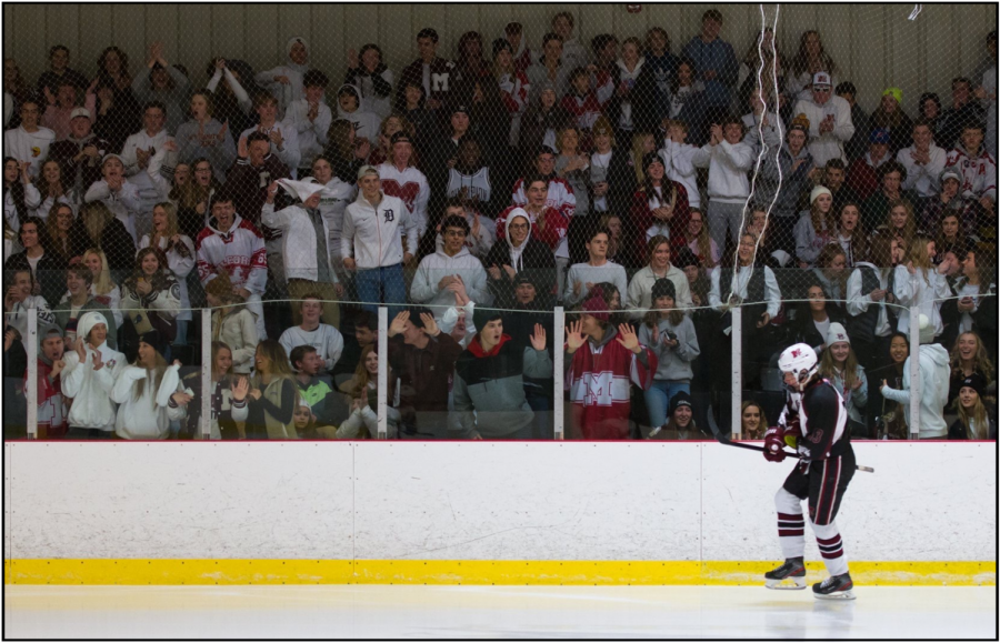 Hockey student section goes crazy as Pierce Ashcroft skates past