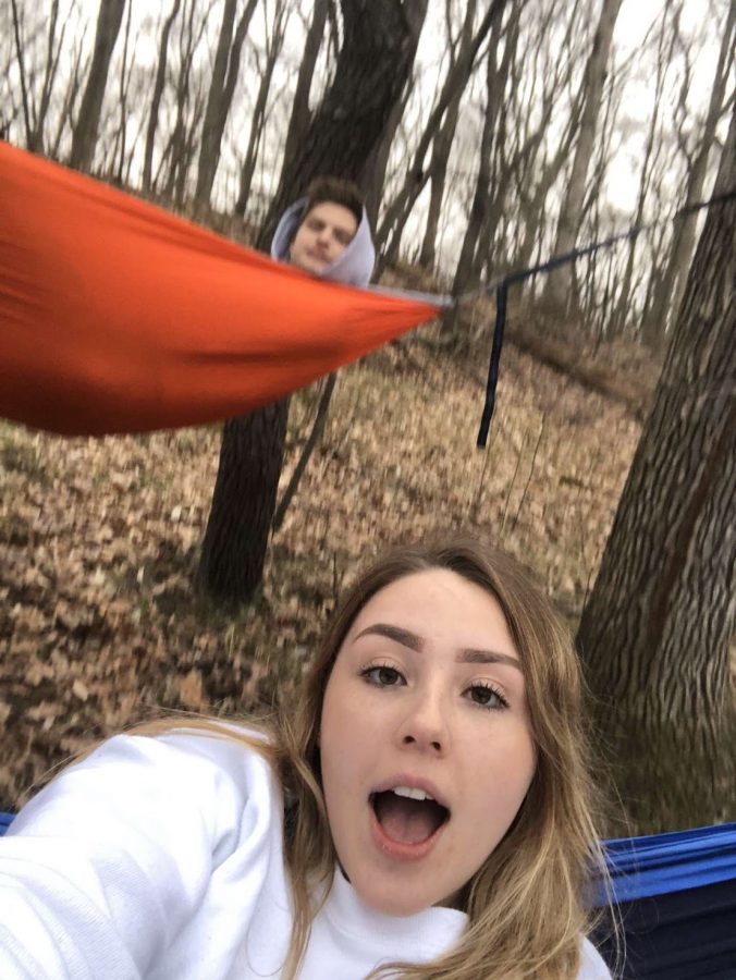 Senior couple Abbie Kozel and Coby Hutter are trying their best to stay connected during the statewide lockdown. Here they are practicing social distancing hammocking. 