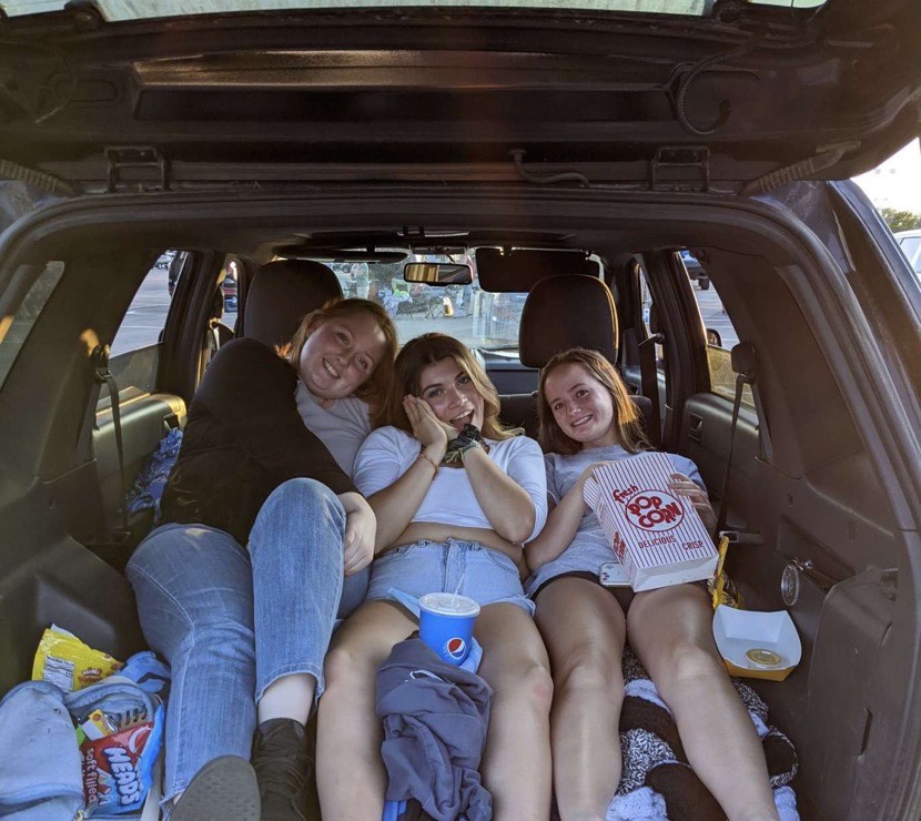 (Left to right) MHS seniors Tess Wyniemko, Aspen Snyder, and Sadie Guffy enjoying a movie at the Plymouth Summer Drive-In.