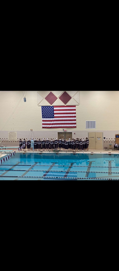 The MHS swimmers and divers all locked arms for the National Anthem during the home meet.