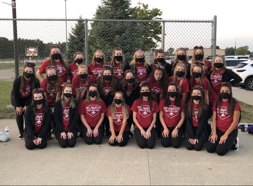 Depicted above is the 2020-2021 Varsity Pom team at the first home game.