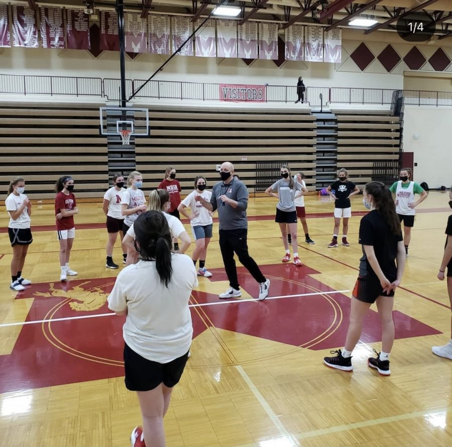 Coach Jenkins talked to the girls program members about the practice plan (Photo courtesy of Clay Shaver).