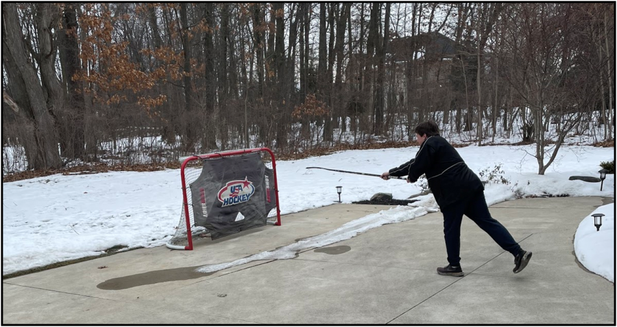 Raya getting shots in his driveway to prepare for the season that he is unsure he will have (Photo by Caleb Holmes-McGahan).
