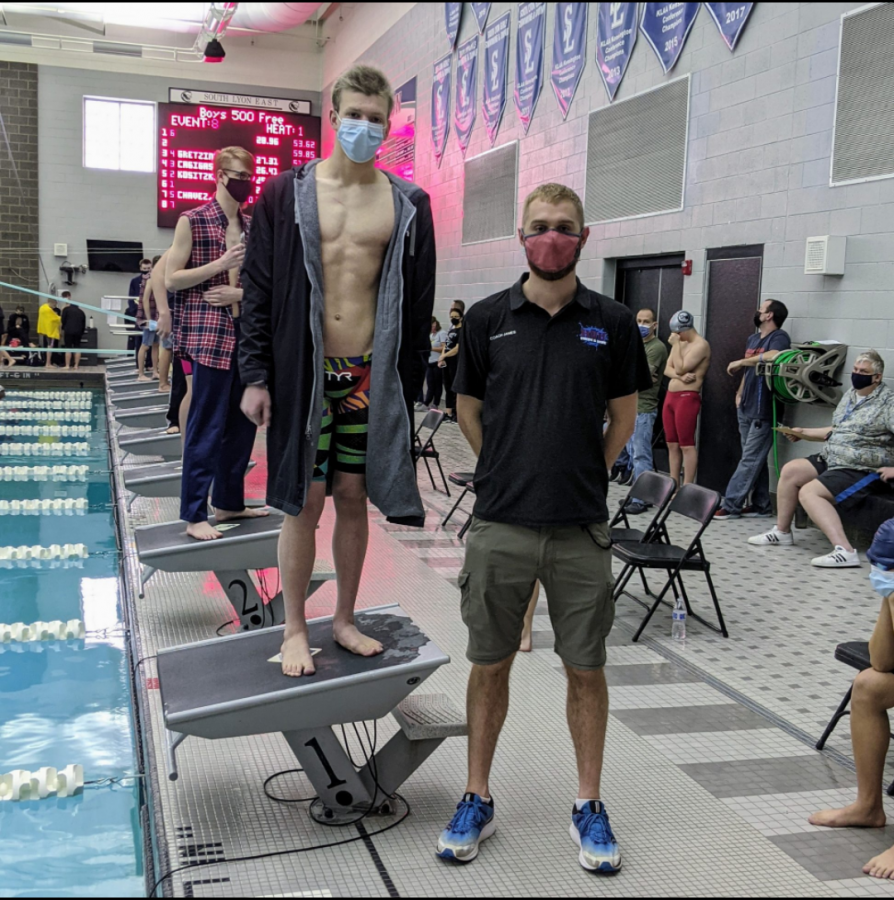 Junior Fletcher Smith and Head Coach James Schuler at South Lyon East this season. Smith has qualified to race at the state meet in March (Photo courtesy of Coach James Schuler).