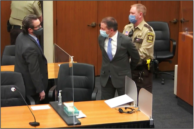 Chauvin being handcuffed and escorted out of the courtroom after the verdict was announced.