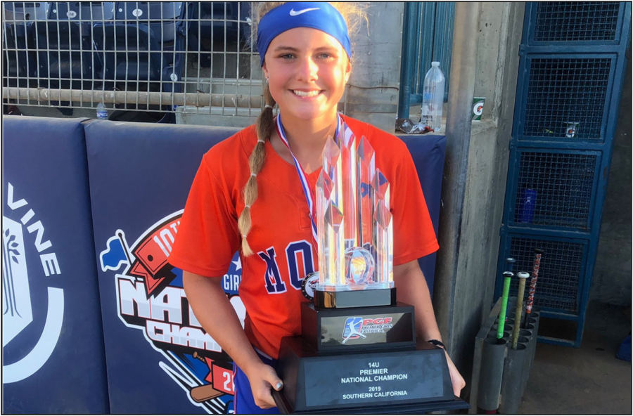 Taylor Pannell stands with the PGF 14U National Tournament trophy.