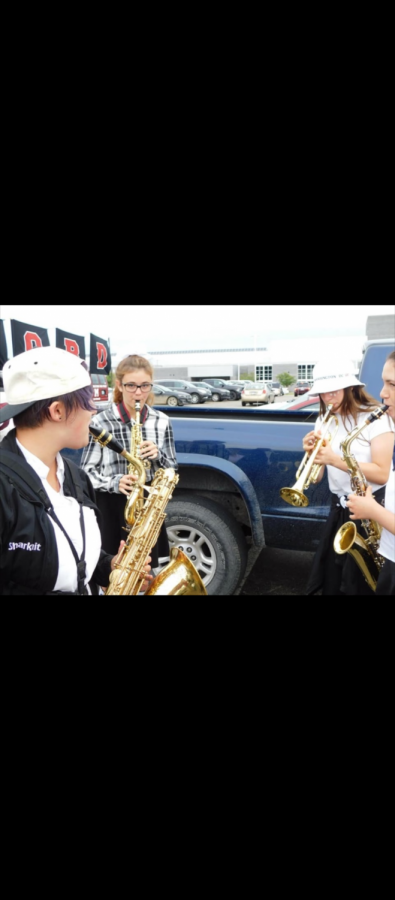 MHS band members gathered outside Walled Lake Northern High School before a performance  at an away football game (Photo courtesy of Keeley Boynton).
