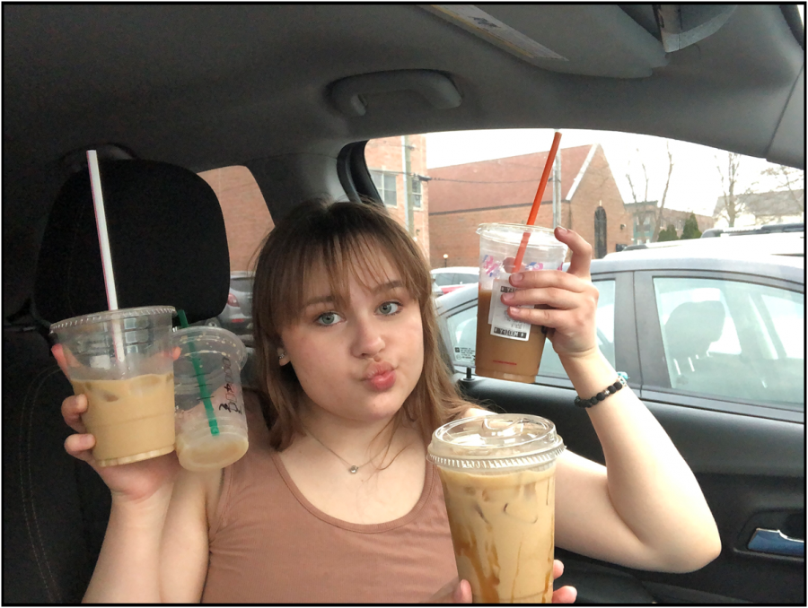 Ansley Kopp holds four coffees, one from each place that her and Annabelle visited. From left: Two Brothers, Starbucks, Dunkin’ (upper right), Brighton Coffeehouse and Theater (lower right).