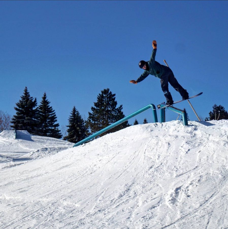 Milford Senior Will Colone showing his board skills with a steezy front board over the elbow rail in the Terrain Park at Alpine Valley
