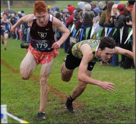 Senior Tyler Ristau dives for the finish line to outplace Northern’s Evan Rice by .02 seconds and displace Lakeland to claim Regional Championship by 1 point.