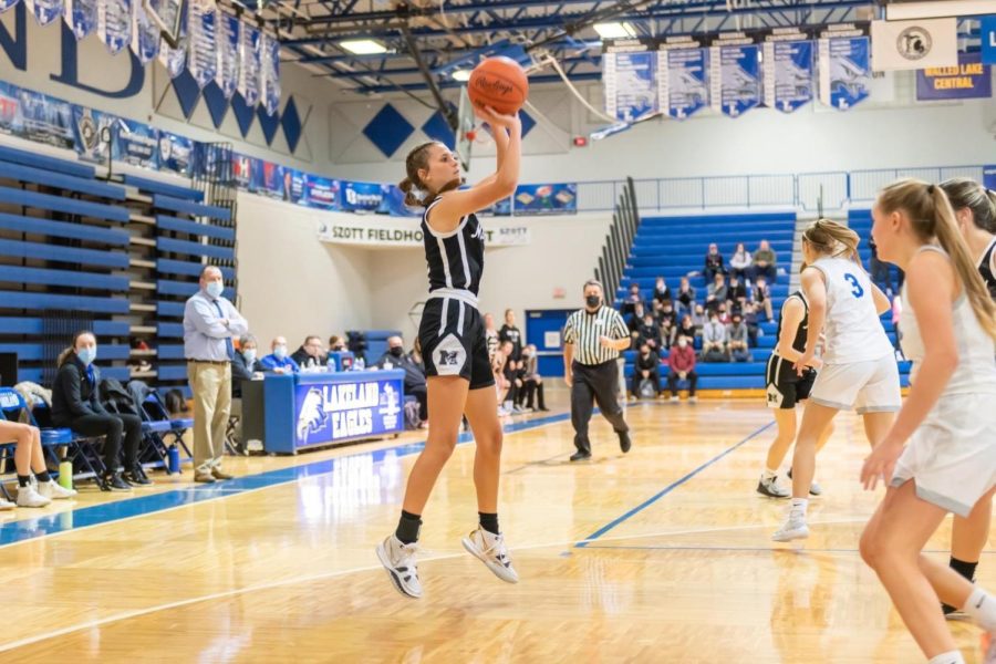 Senior Taylor Mitchell taking a shot in the rivalry game against the Lakeland Eagles.