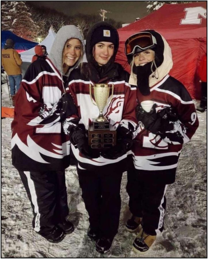 Junior Meggie Martin (left), Senior Dani Ryan (middle), and Junior Casey Meadows (right) holding state trophy.