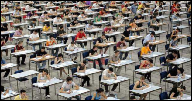 A room full of students taking a standardized test 