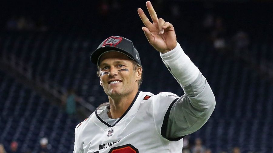 Brady waving goodbye after spending the past 22 seasons in the NFL and setting multiple records.