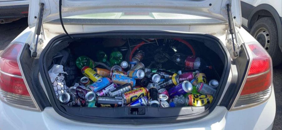 Senior Noah McGrath’s trunk containing an ever-growing pile of old energy drinks (Photo courtesy of Ryan Hanlin).
