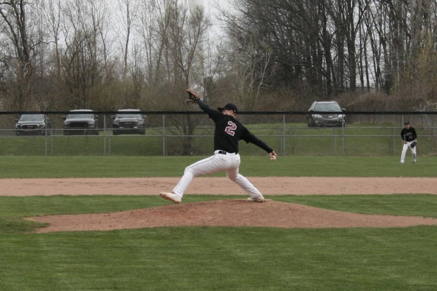 Senior Logan McLaughlin delivering a pitch in his fifth inning of work. McLaughlin would prove to be a huge part of this team win as he made Tate Farquhar roll over on his 105th pitch to second base to win the game (Photos courtesy of Brad Beyer).