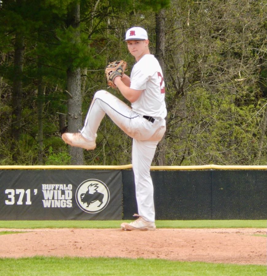 Senior Logan McLaughlin pitching while playing the game he loves, which is something he can’t live without. On Dec. 2021, he announced his commitment to play baseball at Hillsdale College (Photo courtesy of Logan McLaughlin).
