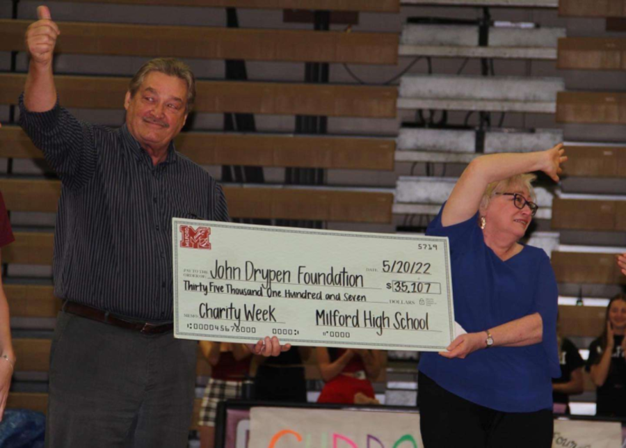John Drypen’s parents receiving the check of charity funds raised at MHS.