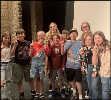 The victorious fifth graders pictured with the hosts of the show. From left to right: Sophia Lieder, Findley Cook, Lilliana Ciaverilla, Layla Perry, Sean Toth, Bradley Mitchell, Abram Cichosz, Megan Rutherford, Lillian Stine, and Brooke Beer.