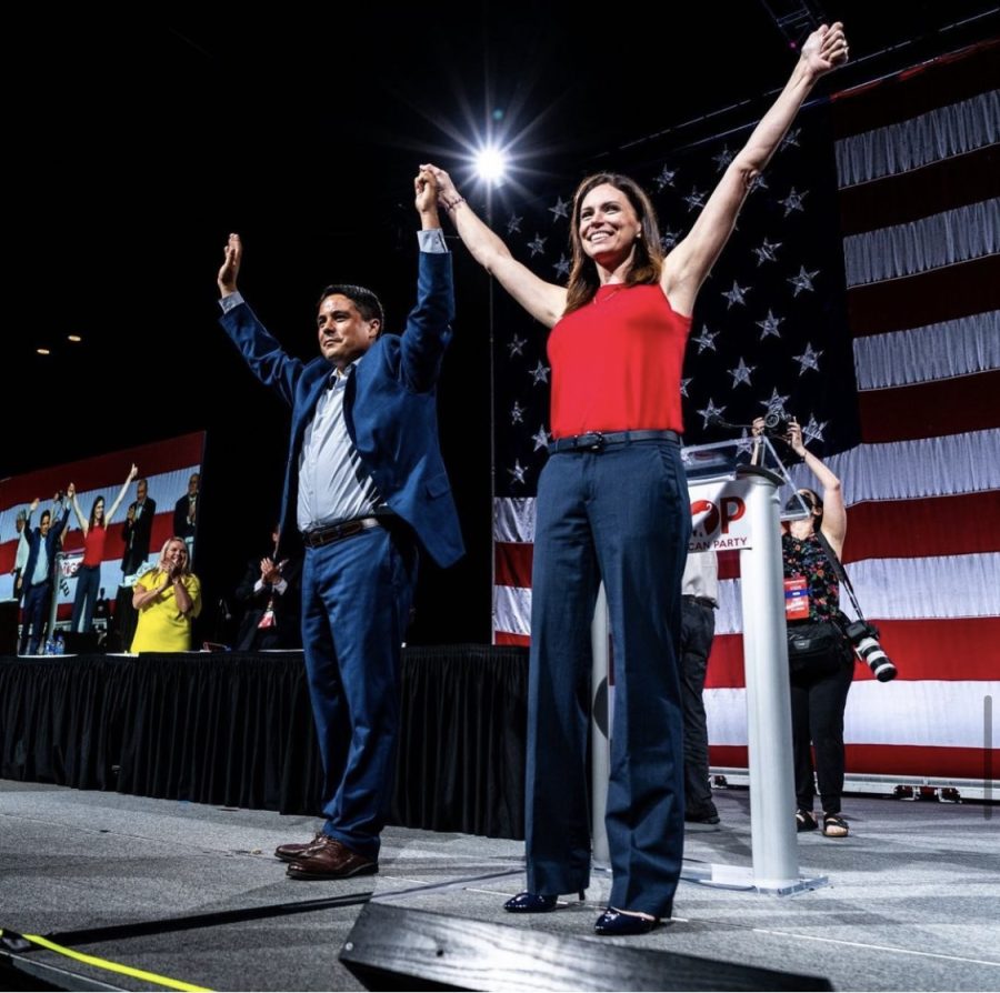 Dixon on stage at Michigan state convention with running mate Shane Hernandez (Photo courtesy of Midland News).