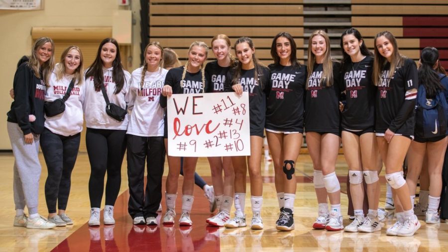 Milford girls showing their support to seniors on the team.