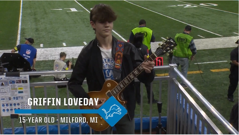 Griffin+Loveday+on+stage+during+Detroit+Lions+Halftime+show%2C+playing+Guns+N%E2%80%99+Roses+song+for+the+fans+at+Ford+Field.