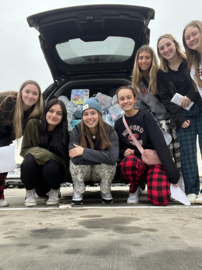 Students+pile+their+trunk+with+gifts+after+shopping+in+Novi+with+the+funds+raised+%0A%28Photo+courtesy+of+Courtney+Drew%29.