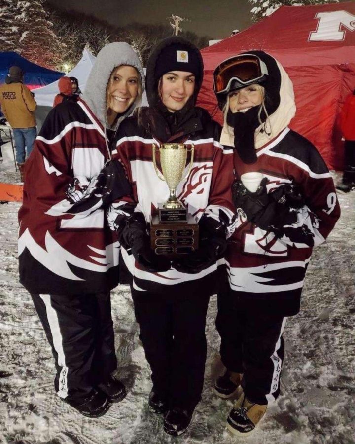 Meggie Martin, Dani Ryan, Casey Meadows, holding the conference title trophy.